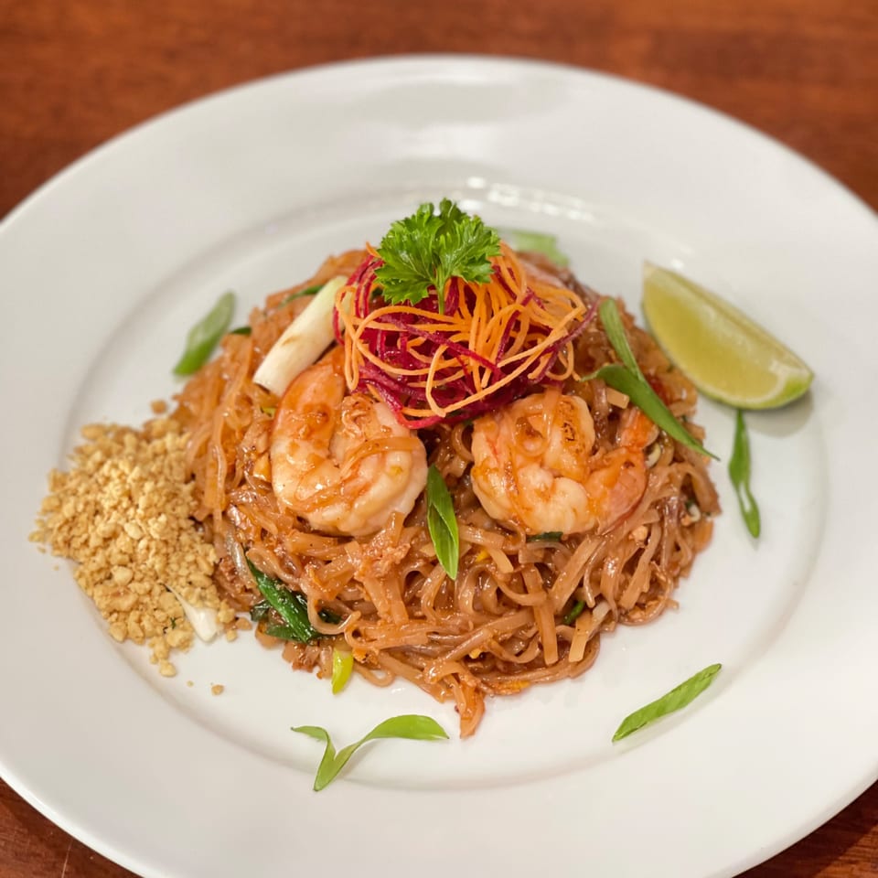 My Black Thai's shrimp Pad Thai with noodles, crushed peanuts, lime, and fresh herbs.